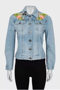 Denim jacket decorated with embroidery