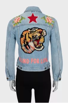 Denim jacket decorated with embroidery