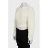 Knitted sweater with a figured collar