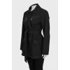 Jacket with a belt, buttons and a zipper