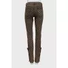 Jeans with branded decor at the bottom