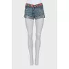 Denim shorts with printed belt