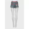 Denim shorts with printed belt