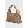Shoulder bag in signature print