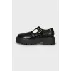 Leather shoes with embossing and perforation