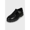 Leather shoes with embossing and perforation