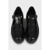 Leather shoes with embossing and perforation