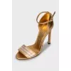 Gold leather stiletto heeled sandals