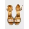 Gold leather stiletto heeled sandals