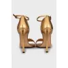 Gold leather stiletto heeled sandals
