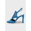 Suede sandals with perforated heels