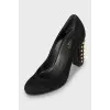 Suede shoes decorated with spikes