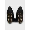 Suede shoes decorated with spikes