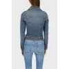 A fitted jeans jacket with a decorative line