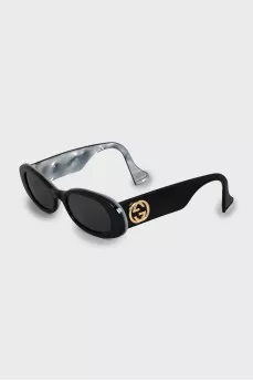 Oval sunglasses with gold logo