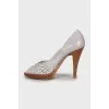 Leather shoes with perforated heels
