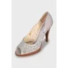 Leather shoes with perforated heels