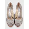 Leather shoes with perforated heels