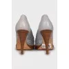 Leather shoes with perforated heels