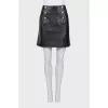 Leather skirt with gold fittings