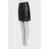 Leather skirt with gold fittings