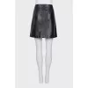 Leather skirt with gold fittings