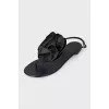 Black sandals decorated with a flower
