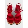 Red sandals with woven soles
