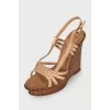 Leather sandals with braided elements