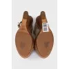 Leather sandals with braided elements