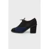 Black shoes with a blue suede insert