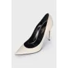 White leather pumps