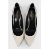 White leather pumps
