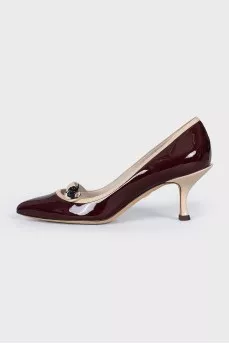 Brown shoes with decorative fastener
