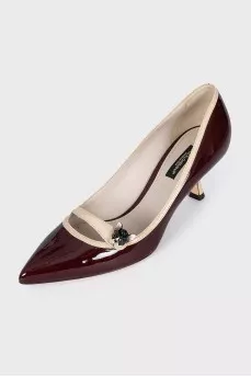 Brown shoes with decorative fastener