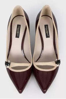 Brown shoes with decorative fastener