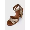 Leather sandals with metal flower