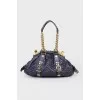 Texture bag with golden fittings