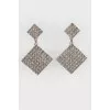 Clips in the form of rhombuses with stones