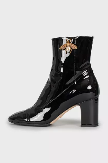 Patent leather ankle boots with signature decor