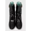 Patent leather ankle boots with signature decor