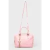 The bag is quilted with golden fittings