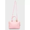 The bag is quilted with golden fittings