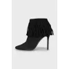 Black suede ankle boots with fringe