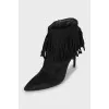 Black suede ankle boots with fringe
