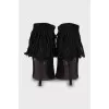 Black suede ankle boots with fringe