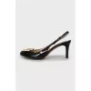 Patent leather slingbacks with golden bow