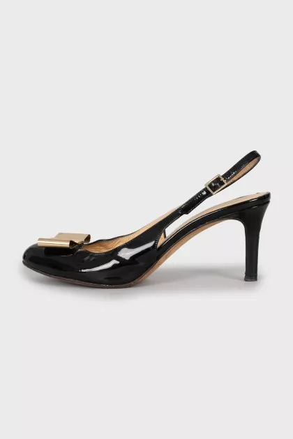 Patent leather slingbacks with golden bow