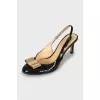 Patent leather slingbacks with golden bow