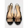 Patent leather slingbacks with golden bow